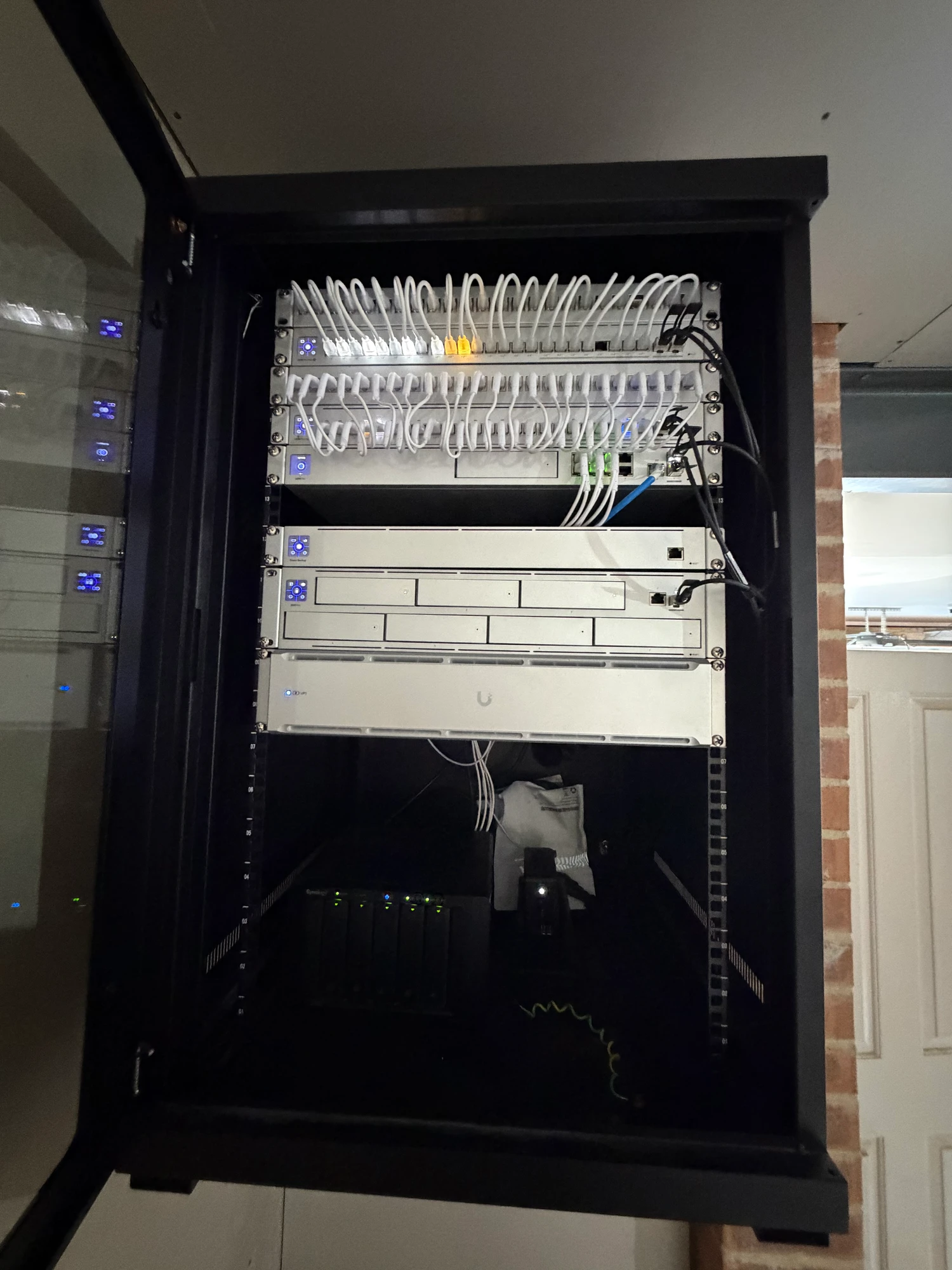 Network rack with patch cabling, switches and connected equipment